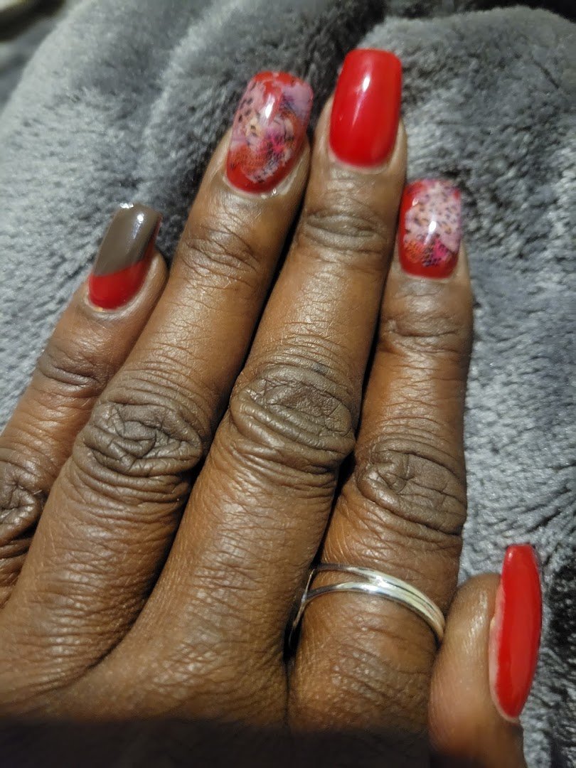 Manicured nails displayed on a salon table.