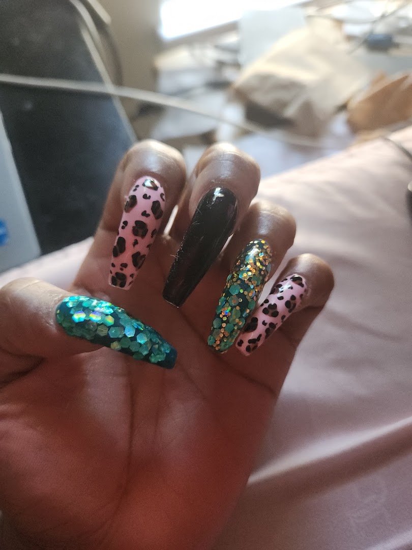 Close view of polished nails and nail tools.